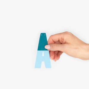 Hand Holding Two Tone Letter From Mini Custom Party Banner Decoration With Personalised Message